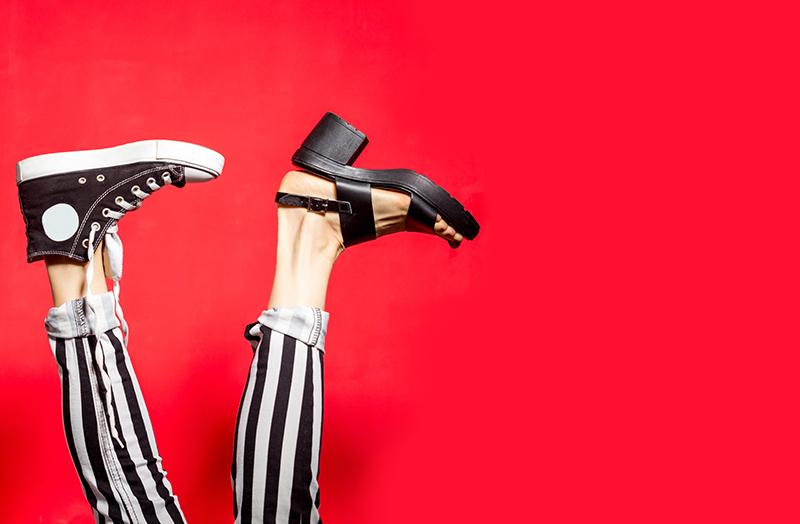 Person wearing a sneaker and a shoe similar to a/b testing