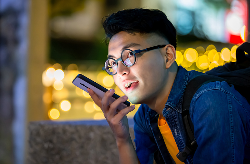 Man on phone talking about the benefits of quality copywriting